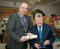 Cathal Treacy, Limerick Chamber President, presenting the award of Honorary Life Membership to Tadhg Kearney