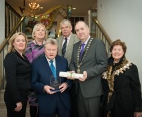 Tadhg Kearney receiving award for Honorary Life Membership of Limerick Chamber with family and friends