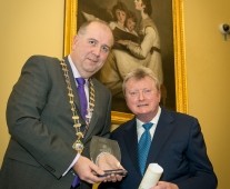 Cathal Treacy, Limerick Chamber President, presenting the award of Honorary Life Membership to Tadhg Kearney