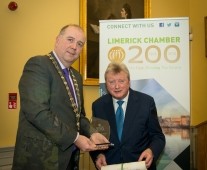 Cathal Treacy, Limerick Chamber President, presenting the award of Honorary Life Membership to Tadhg Kearney
